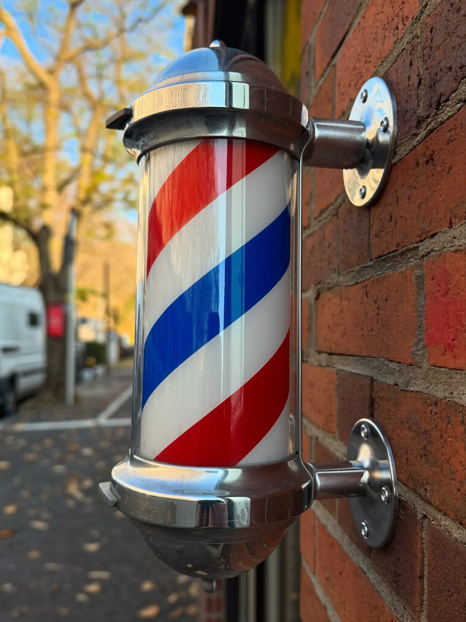 Classic barber pole outside the shop